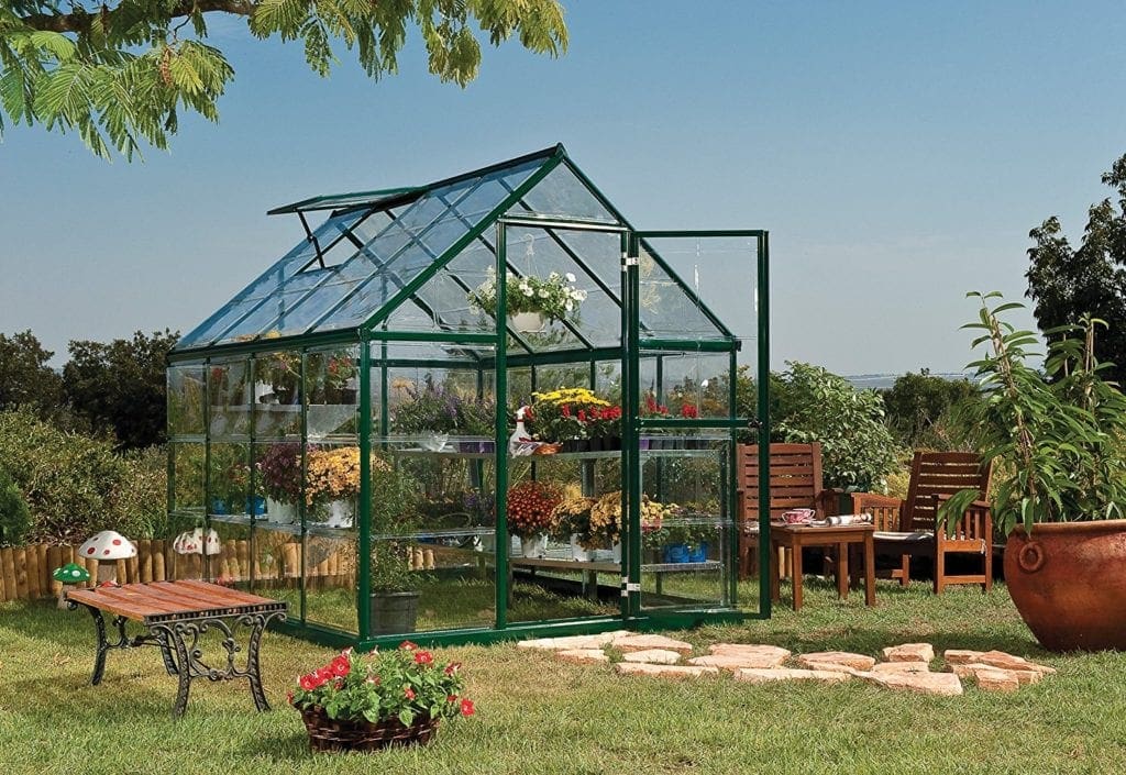 Palram Nature Harmony Greenhouse featuring a sturdy aluminum frame and virtually unbreakable polycarbonate panels, designed to provide optimal growing conditions for plants.