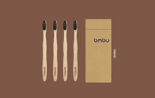 Bmbu Bamboo Charcoal 4-Pack Wooden Toothbrushes, eco-friendly with charcoal-infused bristles for natural cleaning, biodegradable bamboo handles.