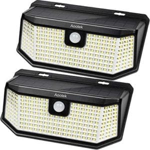Aootek solar motion sensor lights installed outdoors, providing bright illumination with energy-efficient solar power.