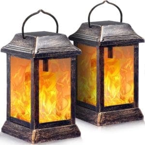 TomCare solar lanterns with a decorative, antique-style design, emitting a soft, warm glow, perfect for outdoor spaces, featuring solar-powered lights for energy-efficient illumination.