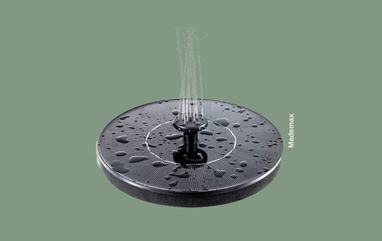 Mademax 1.4W Solar Bird Bath Fountain Pump featuring a compact, round floating design with a built-in solar panel, creating a gentle water spray in a bird bath, perfect for attracting birds and enhancing garden aesthetics.