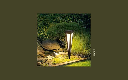 MVBT Modern Outdoor Pathway Solar Lights elegantly illuminate a garden walkway, offering energy-efficient and stylish outdoor lighting.