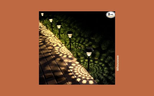 Whousewe 8-Pack Solar Pathway Lights, waterproof and energy-efficient for illuminating outdoor walkways and gardens.