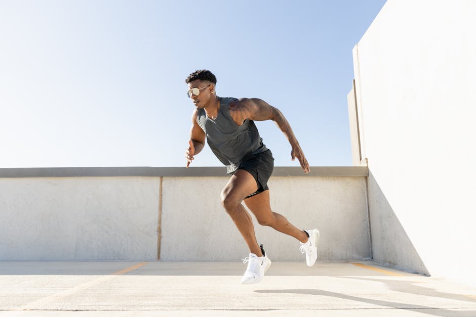 Dynamic image of a man sprinting on a building rooftop, showcasing athleticism and urban lifestyle.